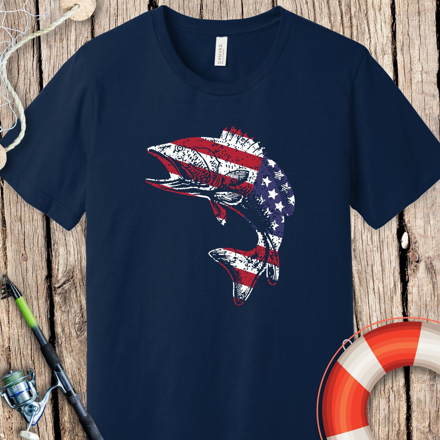 Navy Printify fishing t-shirts featuring a fish with an American flag design on a wooden background